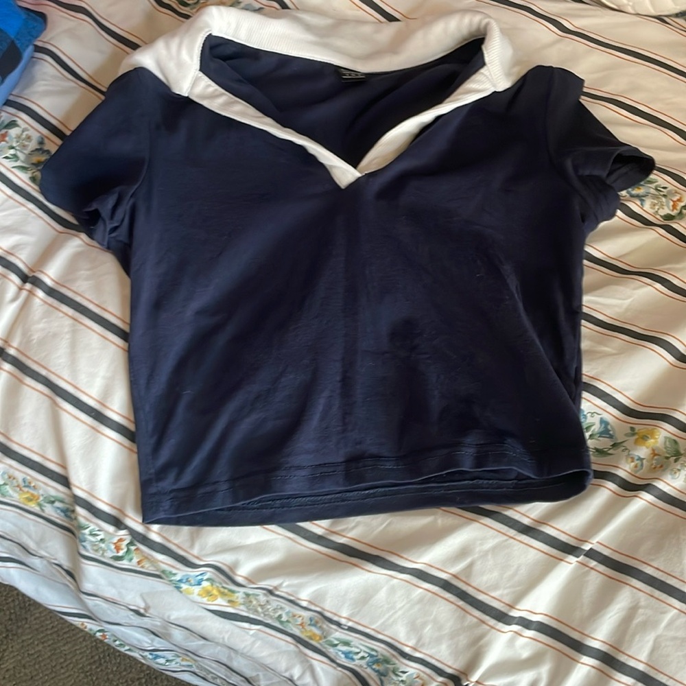 Navy blue shirt with white collar